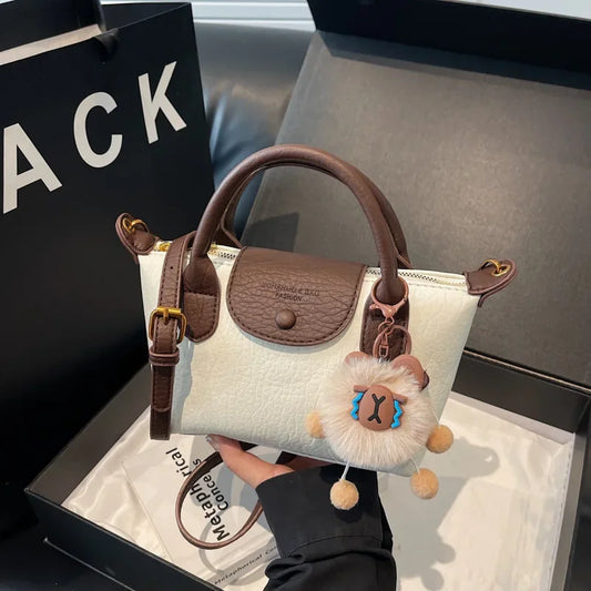 Bolsa crossbody de ombro de grande capacidade em formato de bolinho elegante para deslocamento no outono e inverno com design de bloco de cores