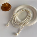 Este outono e inverno novo colar de corrente de suéter redondo, brilhante e quente branco Shijia pérola longa em camadas troude um charme feminino