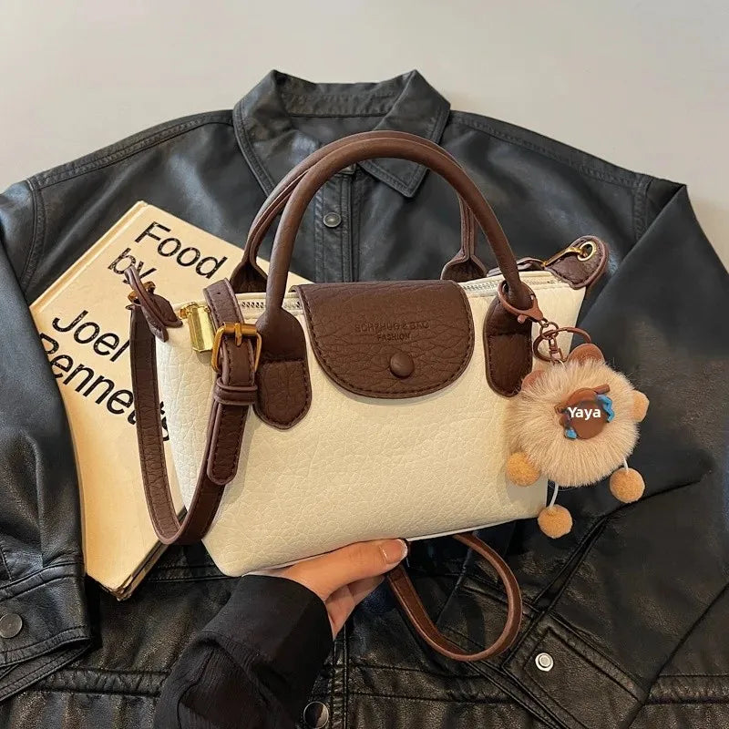 Bolsa crossbody de ombro de grande capacidade em formato de bolinho elegante para deslocamento no outono e inverno com design de bloco de cores