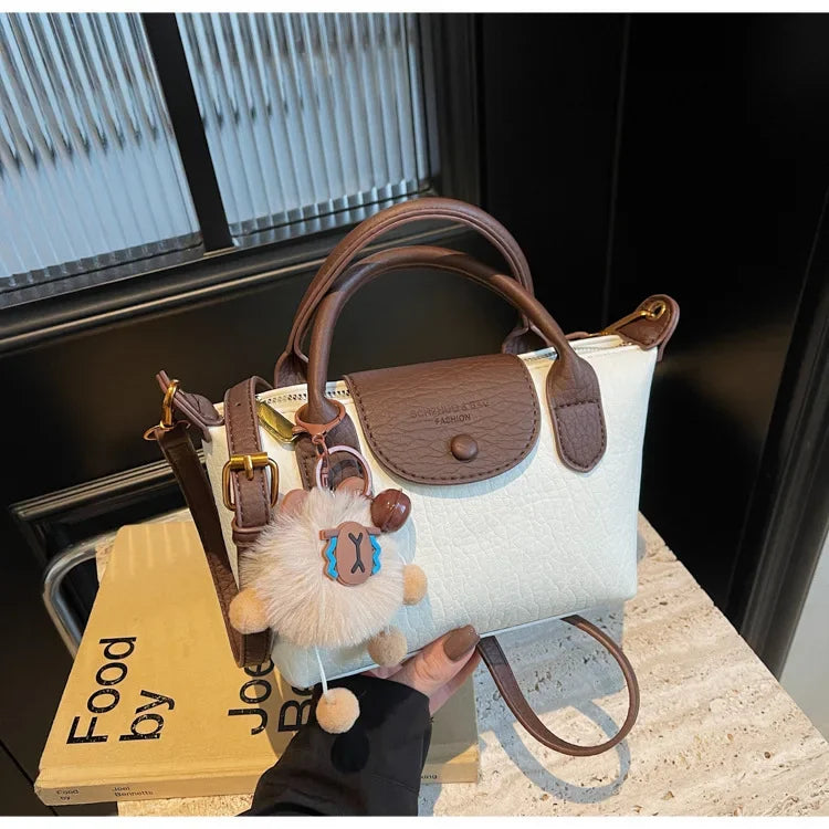 Bolsa crossbody de ombro de grande capacidade em formato de bolinho elegante para deslocamento no outono e inverno com design de bloco de cores