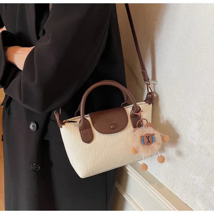 Bolsa crossbody de ombro de grande capacidade em formato de bolinho elegante para deslocamento no outono e inverno com design de bloco de cores