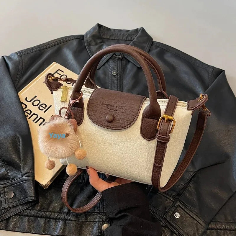 Bolsa crossbody de ombro de grande capacidade em formato de bolinho elegante para deslocamento no outono e inverno com design de bloco de cores